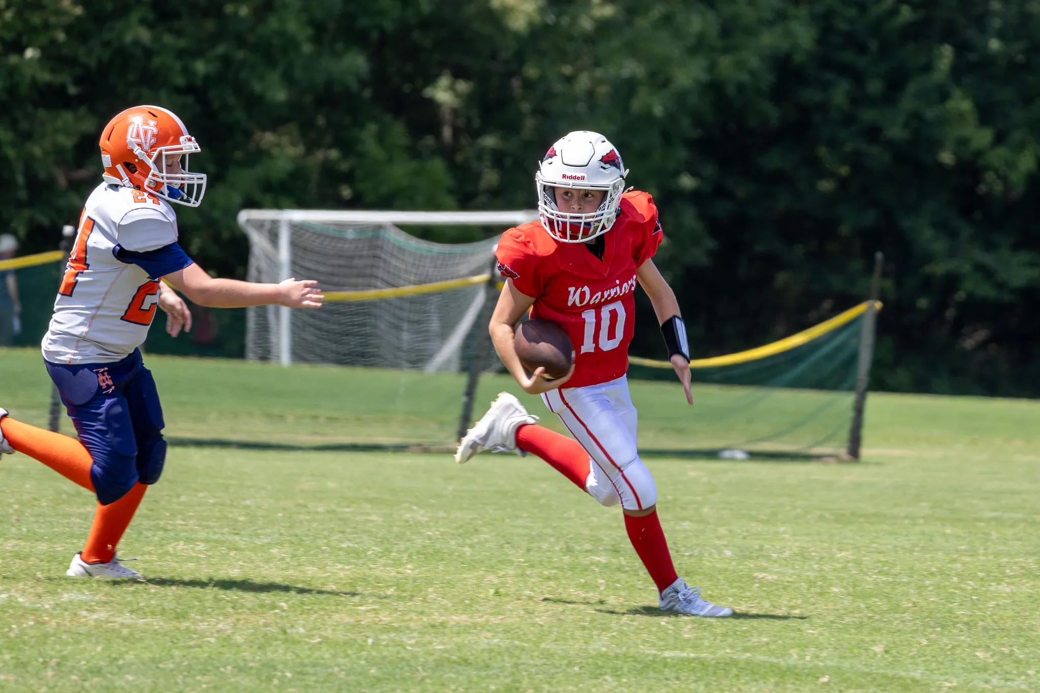Football player running with a football