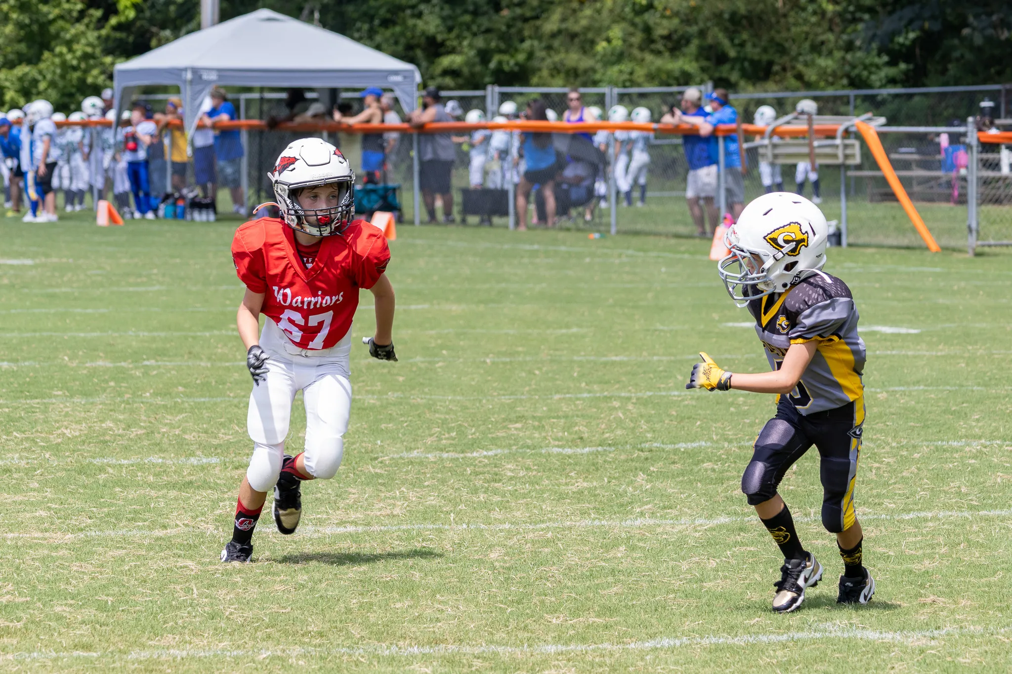 Football players taking off after the snap